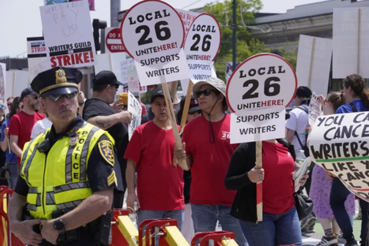 Warner CEO booed at Boston University as supporters of writers' strike picket outside