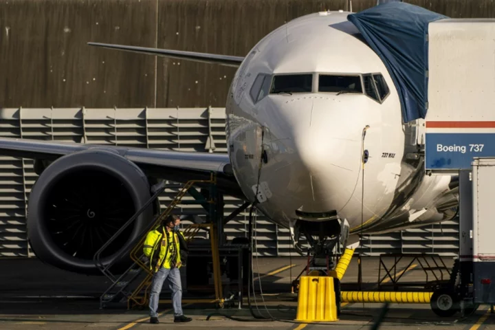 Boeing cuts 2023 forecast for 737 deliveries as it reports loss