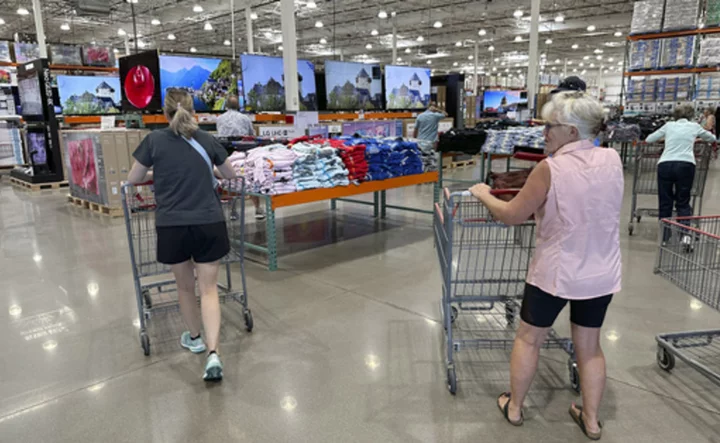 US consumers keep spending despite high prices and their own gloomy outlook. Can it last?