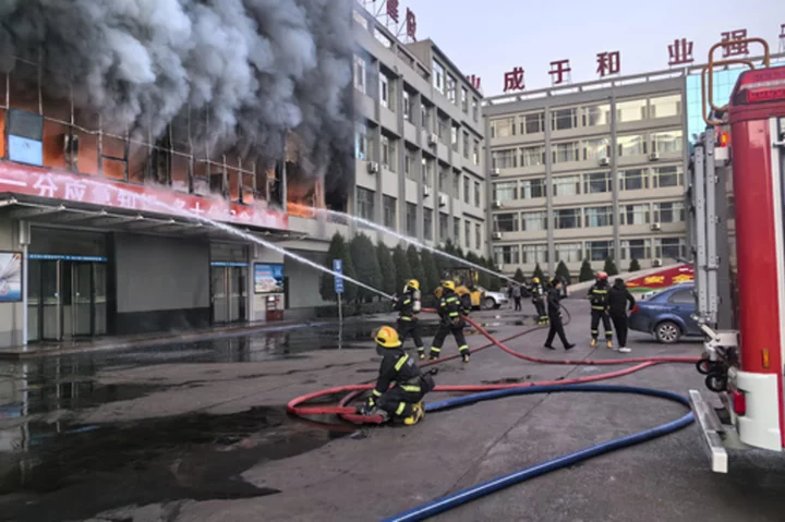 Fire at a coal mining company building in northern China kills 26 and injures dozens