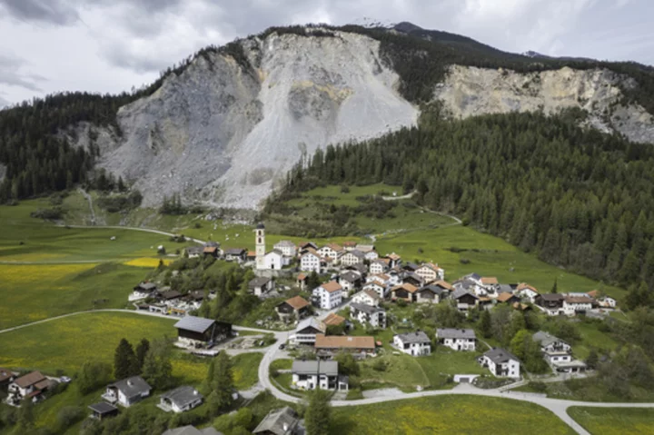 Stragglers pack up as Swiss village is evacuated under rockslide threat