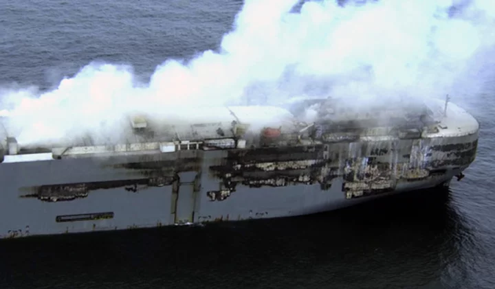 High winds stall efforts to tow a burning cargo ship packed with cars off northern Dutch coast